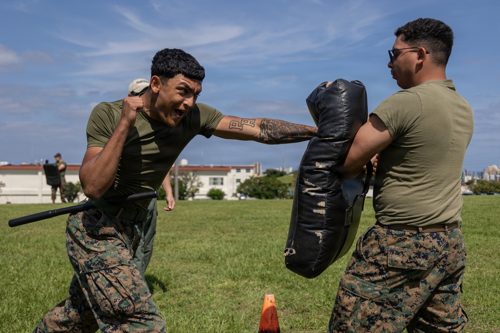Marines and Japanese Security Guards conduct OC Spray training at Camp Foster