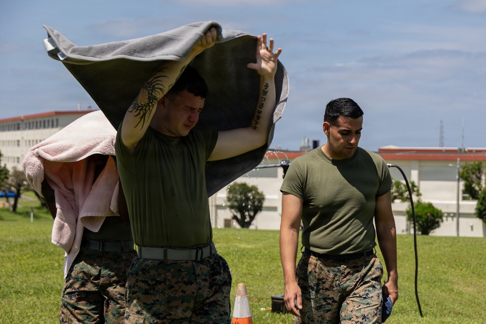 Marines and Japanese Security Guards conduct OC Spray training at Camp Foster