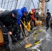 Coast Guard Cutter Barque Eagle's crew conducts deck maintenance