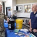 Army soldier and OEM representative discuss emergency preparedness at community outreach event