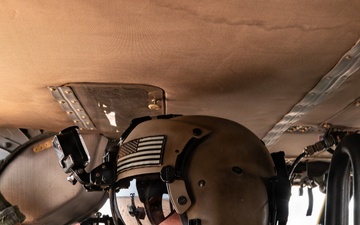 U.S. Army aviator conducts pre-flight checks aboard military helicopter