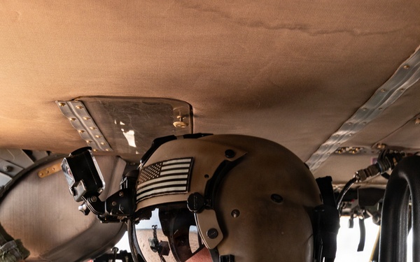 U.S. Army aviator conducts pre-flight checks aboard military helicopter
