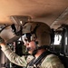 U.S. Army aviator conducts pre-flight checks aboard military helicopter