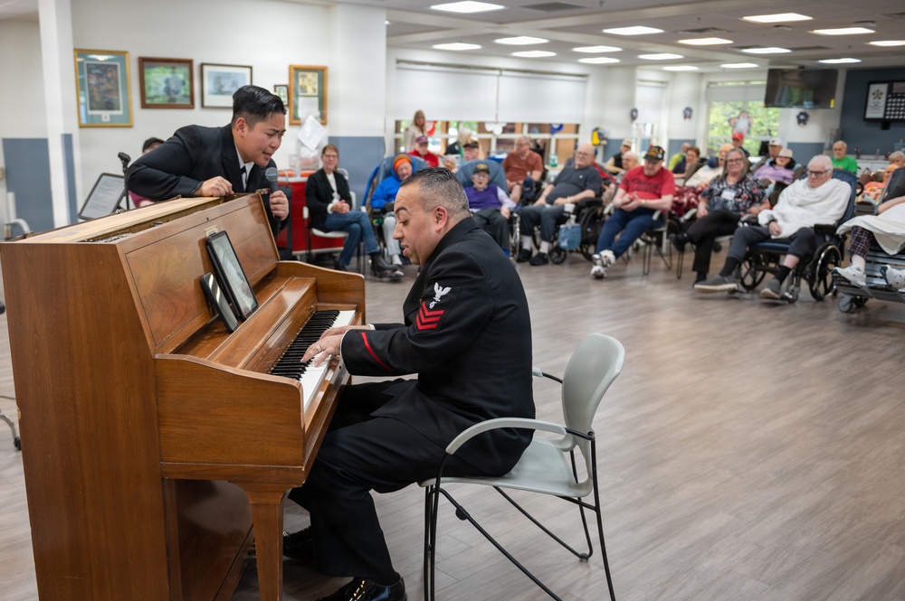 Members of the U.S. Navy Band Cruisers perform at veterans center