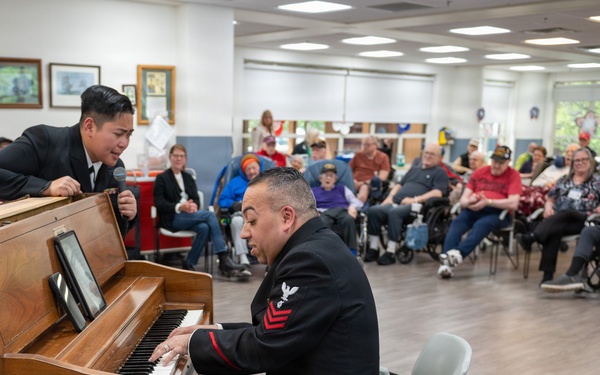 Members of the U.S. Navy Band Cruisers perform at veterans center