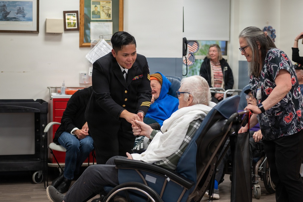 Members of the U.S. Navy Band Cruisers perform at veterans center
