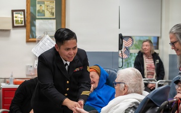Members of the U.S. Navy Band Cruisers perform at veterans center