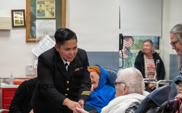 Members of the U.S. Navy Band Cruisers perform at veterans center