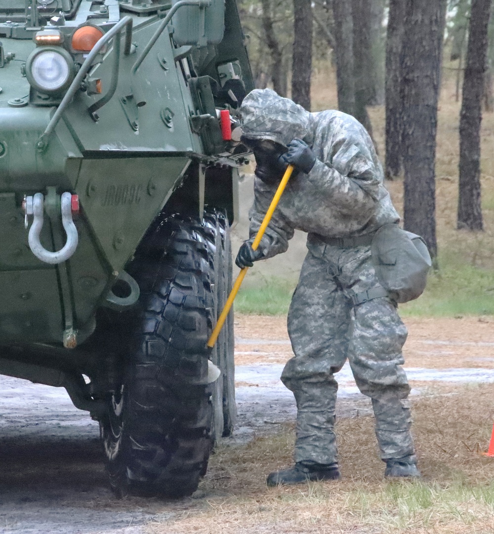 JB MDL- 231st Chemical Company Soldier Scrubs Stryker During Decon