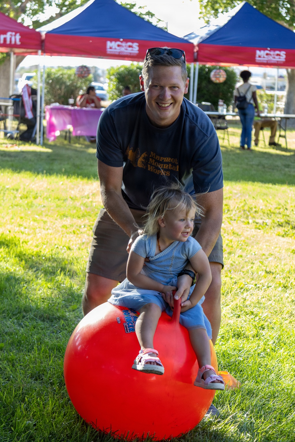 Father and Daughter Enjoy Bounce Ball at MCCS Family Event