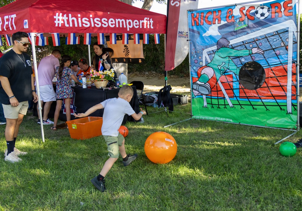 Young child plays Kick &amp; Score game at Marine Corps Semper Fit community event