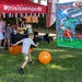Young child plays Kick &amp; Score game at Marine Corps Semper Fit community event