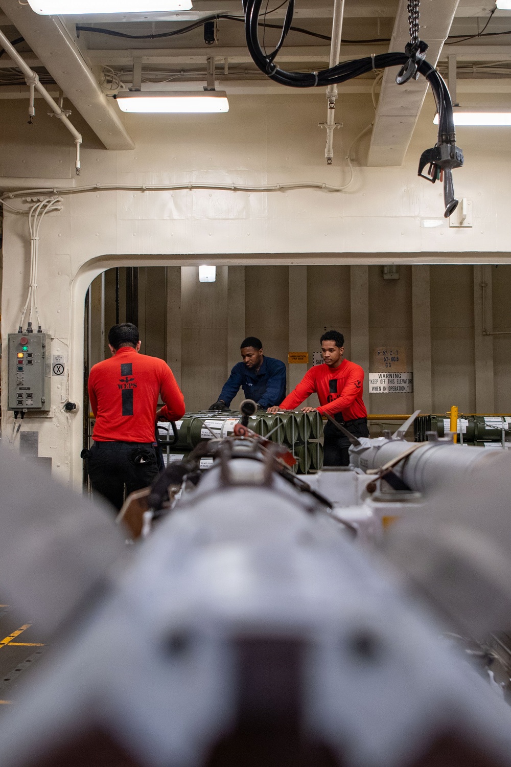 Boxer Sailors Store Ordnance