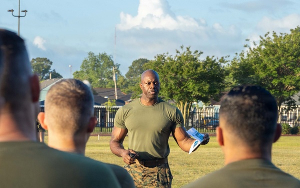 Marines attending 1st Sgts. Symposium Conduct physical training