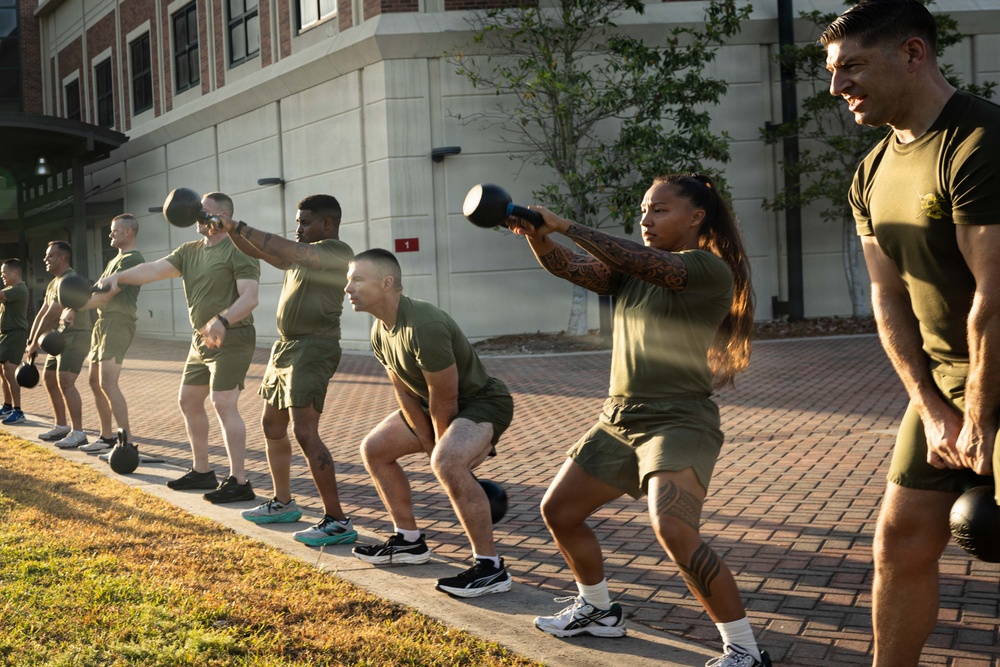 Marines attending 1st Sgts. Symposium Conduct physical training