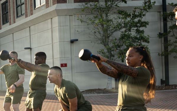 Marines attending 1st Sgts. Symposium Conduct physical training