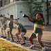 Marines attending 1st Sgts. Symposium Conduct physical training