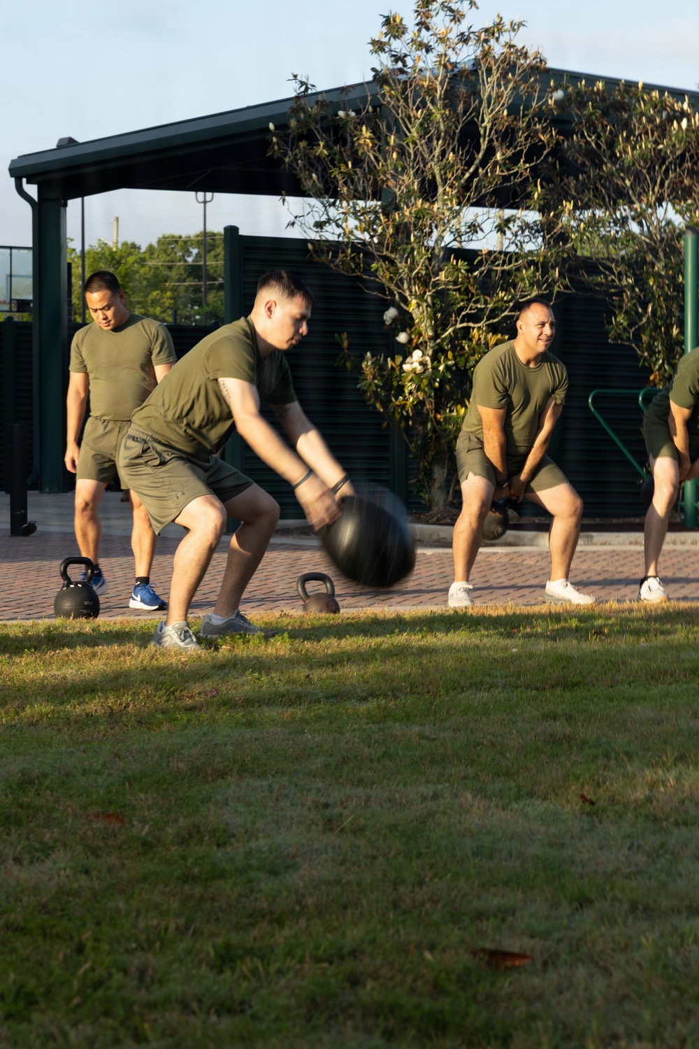 Marines attending 1st Sgts. Symposium Conduct physical training
