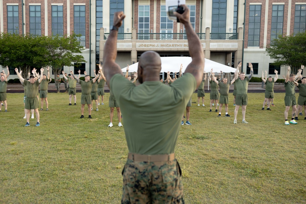 Marines attending 1st Sgts. Symposium Conduct physical training