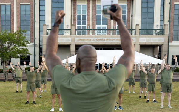 Marines attending 1st Sgts. Symposium Conduct physical training