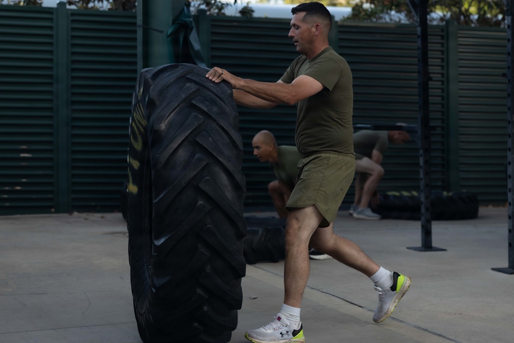 Marines attending 1st Sgts. Symposium Conduct physical training