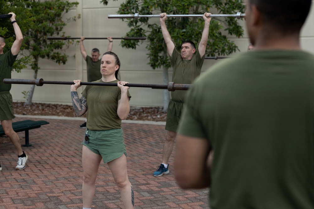 Marines attending 1st Sgts. Symposium Conduct physical training