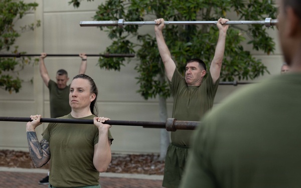 Marines attending 1st Sgts. Symposium Conduct physical training