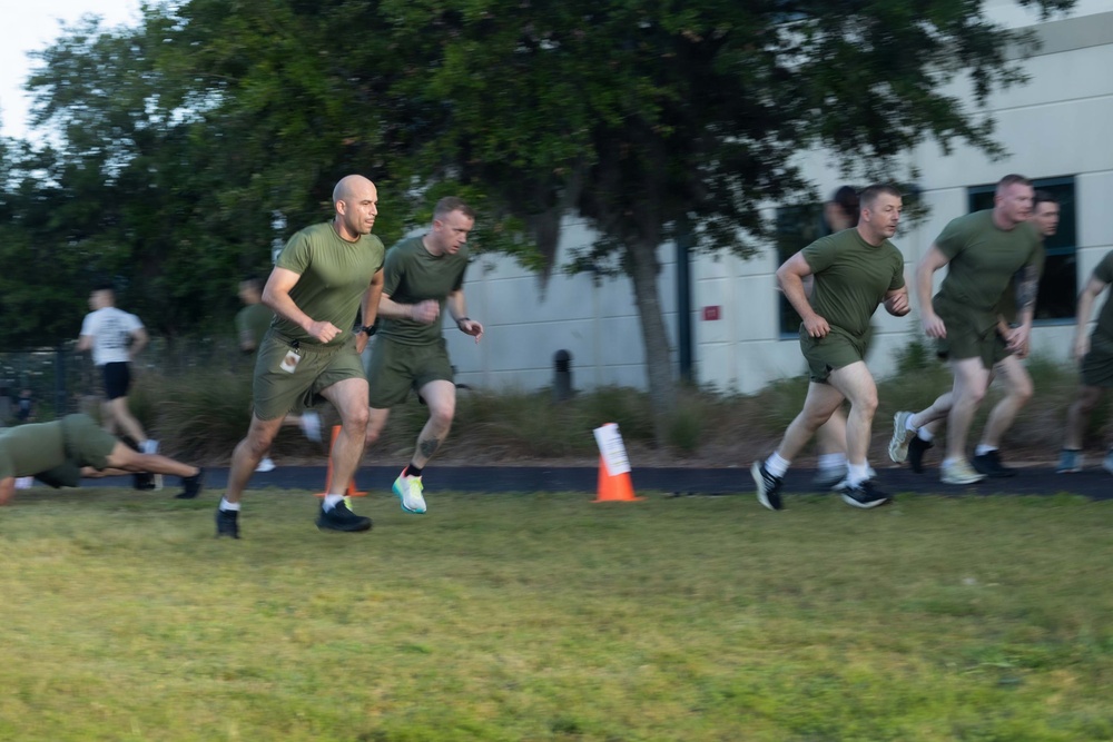 Marines attending 1st Sgts. Symposium Conduct physical training