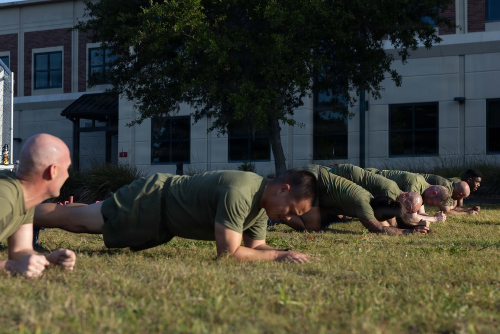 Marines attending 1st Sgts. Symposium Conduct physical training