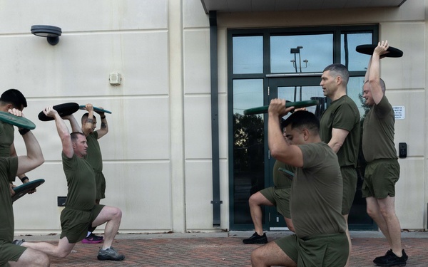 Marines attending 1st Sgts. Symposium Conduct physical training