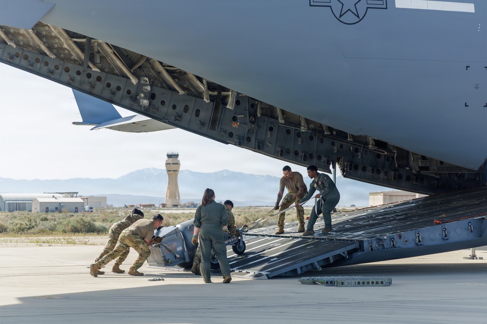 Loadmasters and Logistics Specialists prepare a C-17 for a Mission Readiness Exercise at Edwards Air Force Base