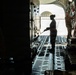 Loadmasters and Logistics Specialists work together to prepare a C-17 for a Mission Readiness Exercise at Edwards Air Force Base