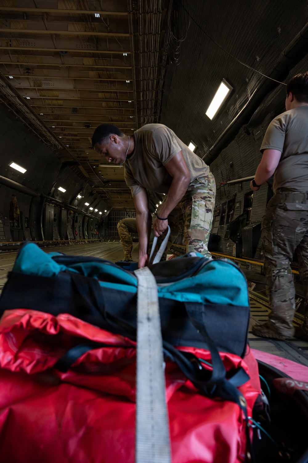 9th AS transports Seabee equipment to INDO-PACOM