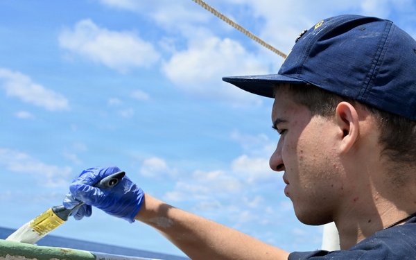 Coast Guard Cutter Eagle crew members conduct vessel preparations