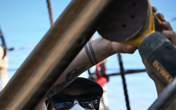 Coast Guard Cutter Eagle crew members conduct vessel preparations