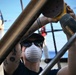 Coast Guard Cutter Eagle crew members conduct vessel upkeep