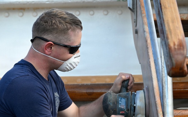 Coast Guard Cutter Eagle crew members conduct vessel preparations