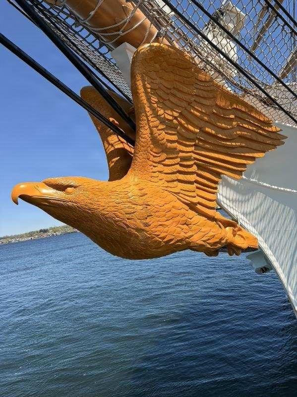Coast Guard Cutter Barque Eagle's repaired figurehead affixed to cutter's bow
