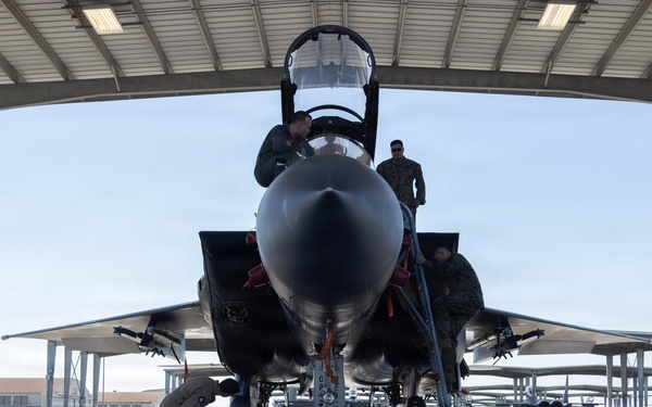 Exercise Garnet Rattler: U.S. Marines conduct range safety brief, F-15E Strike Eagle familiarization, CASEVAC ROC walk