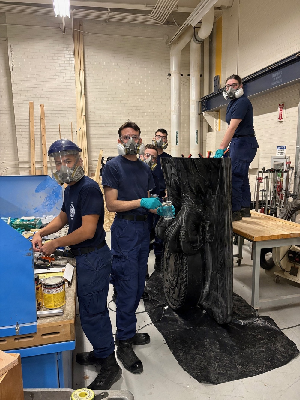 Coast Guard Academy cadets help repair the Eagle figurehead