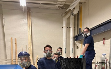 Coast Guard Academy cadets help repair the Eagle figurehead