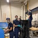 Coast Guard Academy cadets help repair the Eagle figurehead