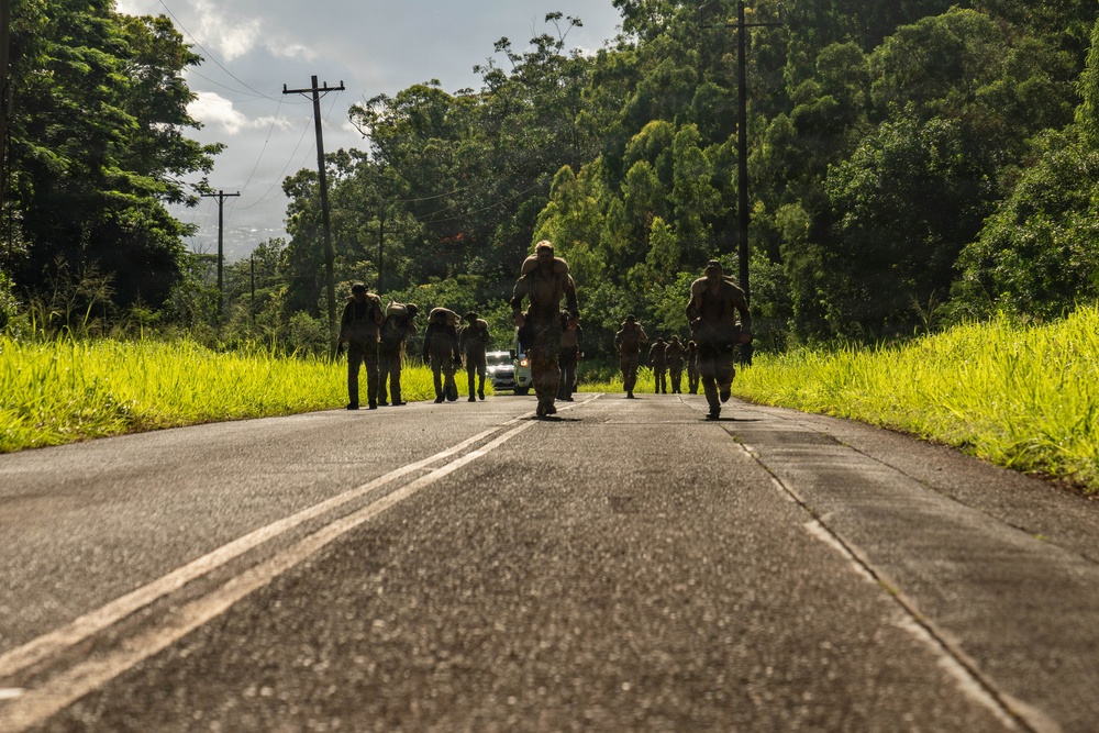 Multinational Soldiers hike Kolekole Pass at the 2026 Pacific Land Forces Team Readiness Challenge