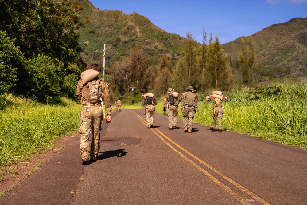 Multinational Soldiers hike Kolekole Pass at the 2026 Pacific Land Forces Team Readiness Challenge