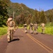 Multinational Soldiers hike Kolekole Pass at the 2026 Pacific Land Forces Team Readiness Challenge