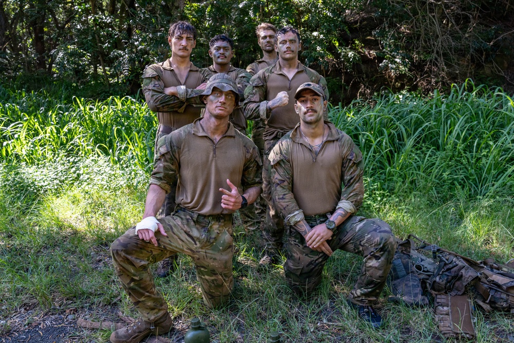 Multinational Soldiers hike Kolekole Pass at the 2026 Pacific Land Forces Team Readiness Challenge