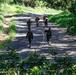 Multinational Soldiers hike Kolekole Pass at the 2026 Pacific Land Forces Team Readiness Challenge
