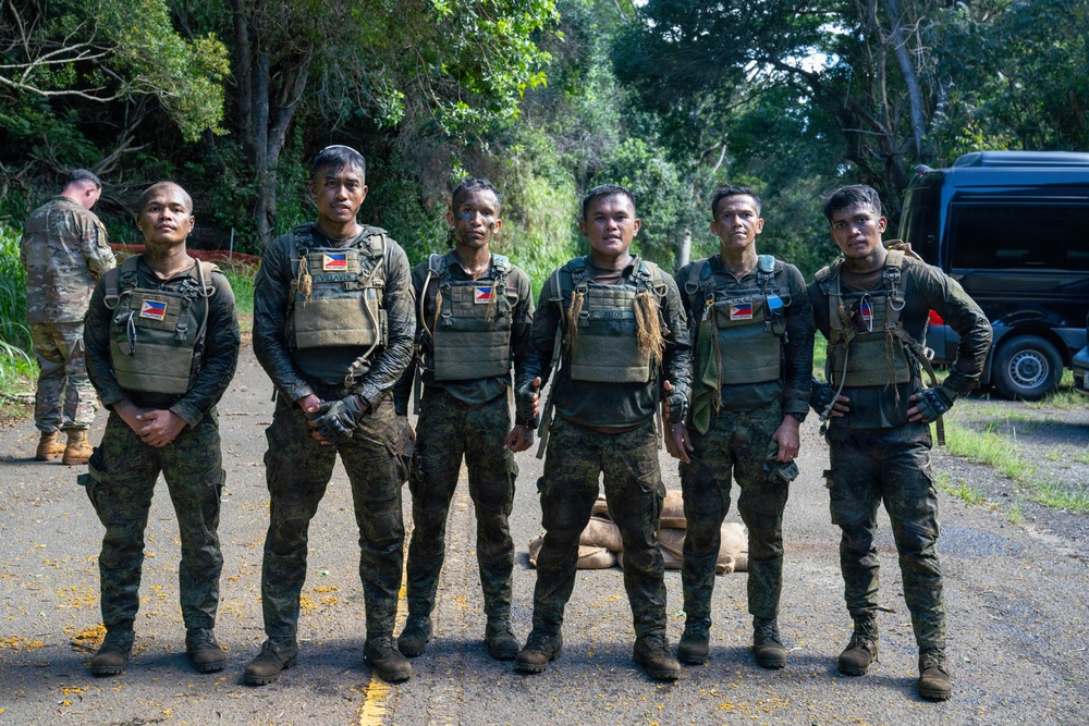 Multinational Soldiers hike Kolekole Pass at the 2026 Pacific Land Forces Team Readiness Challenge