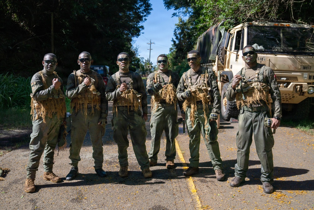 Multinational Soldiers hike Kolekole Pass at the 2026 Pacific Land Forces Team Readiness Challenge
