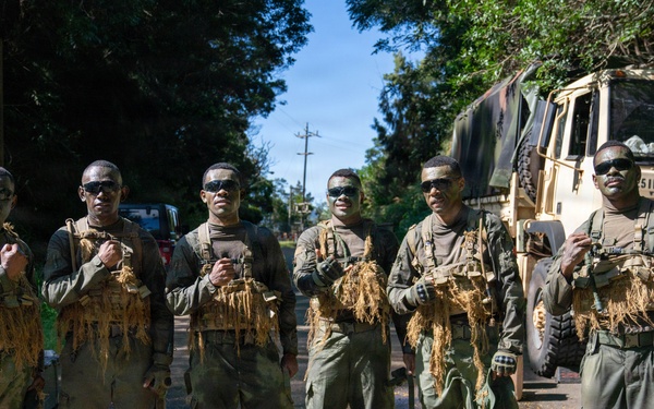 Multinational Soldiers hike Kolekole Pass at the 2026 Pacific Land Forces Team Readiness Challenge